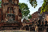 Ayutthaya, Thailand. Wat Mahathat, detail of a small vihara with a chedi and a Buddha image near the eastern side of the eclosure 